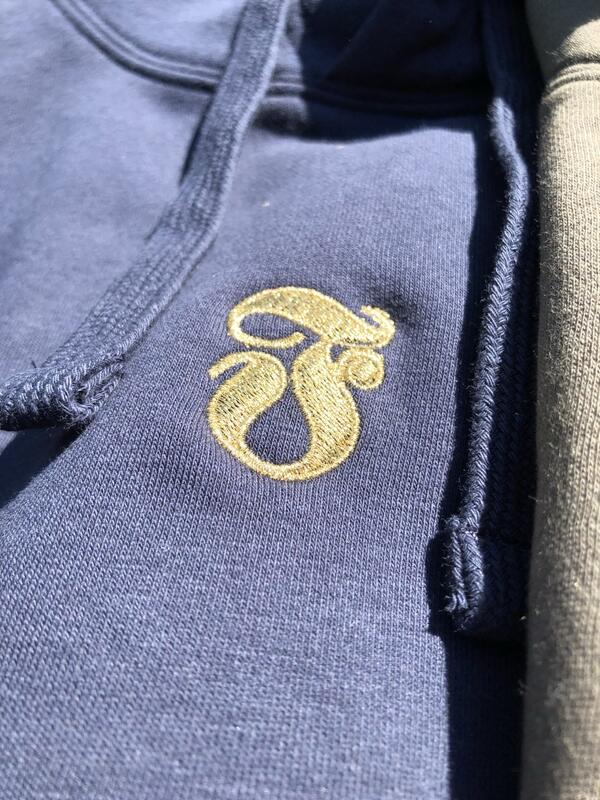 Goldener Stick auf Textil